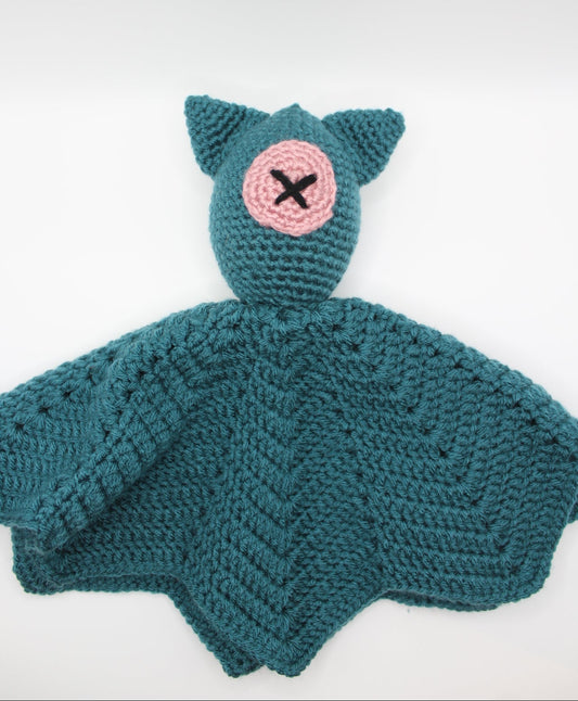 Teal crochet baby lovey with pink button eye.